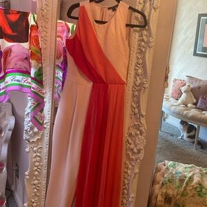 Brand Boston, proper color, red and camel. It’s never been worn it’s beautiful